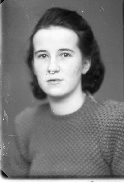 Porträtt av en dam.