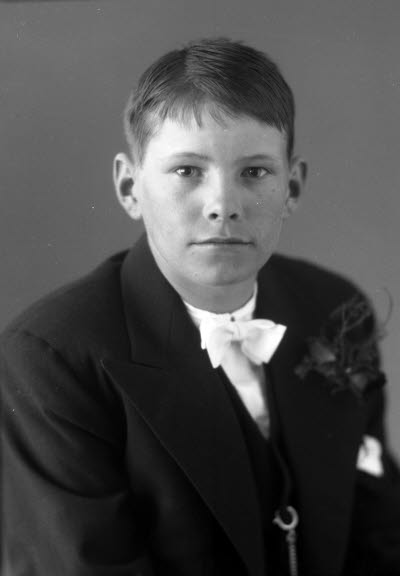 Porträtt av en pojke. Ateljefoto.