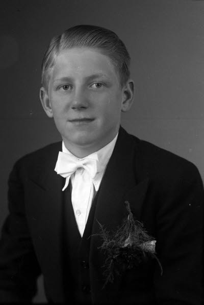 Porträtt av en pojke. Ateljefoto.