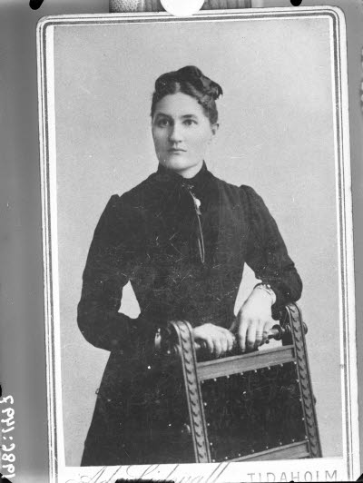 Porträtt av en dam.