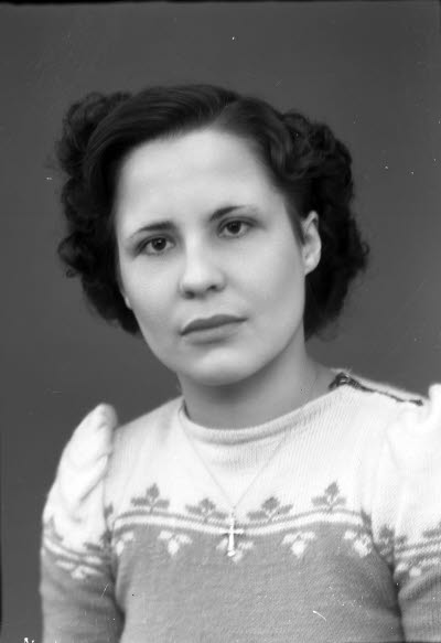 Porträtt av en dam.