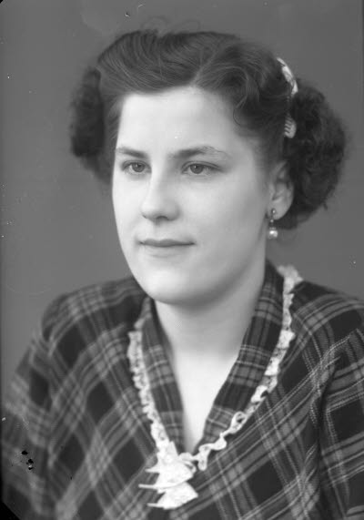 Porträtt av en dam.