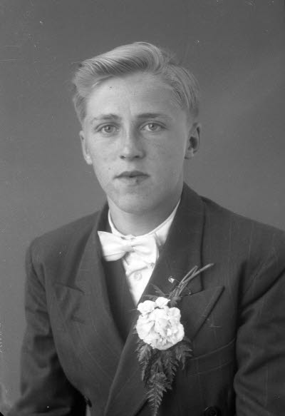 Porträtt av en pojke. Ateljefoto.