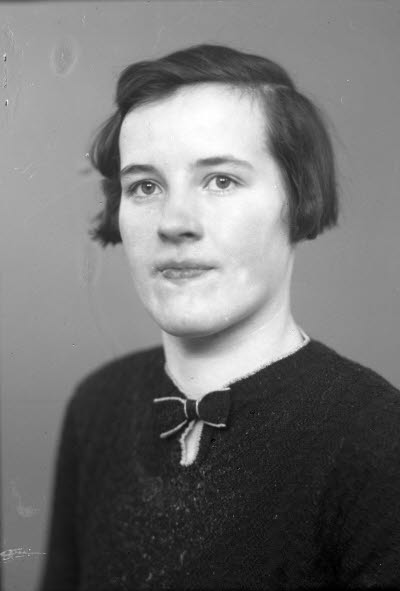 Porträtt av en dam.