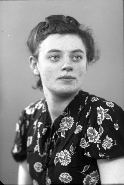 Porträtt av en dam.