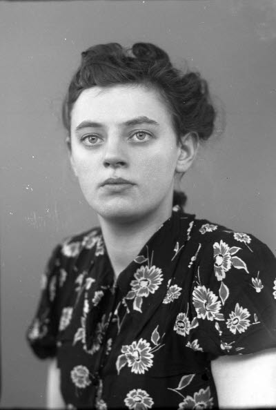 Porträtt av en dam.