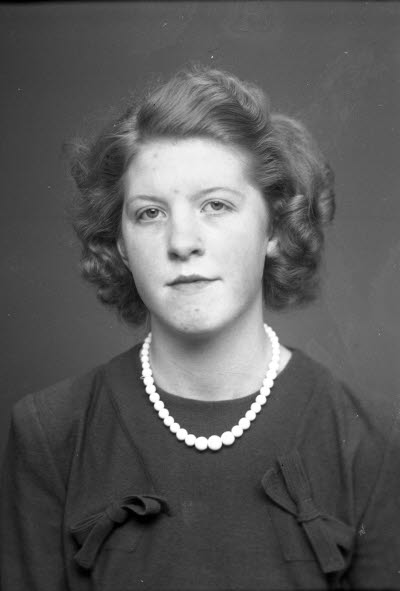 Porträtt av en dam.