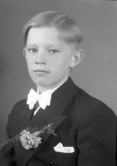 Porträtt av en pojke. Ateljefoto.