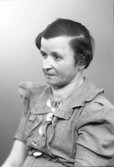 Porträtt av en dam.