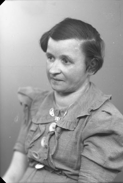 Porträtt av en dam.