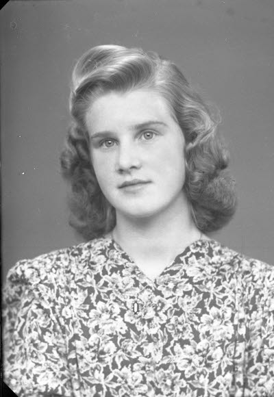 Porträtt av en dam.