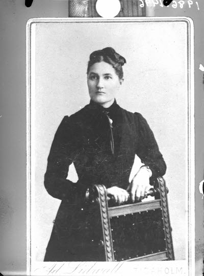 Porträtt av en dam.