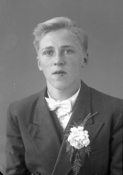 Porträtt av en pojke. Ateljefoto.