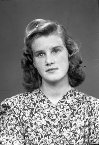 Porträtt av en dam.