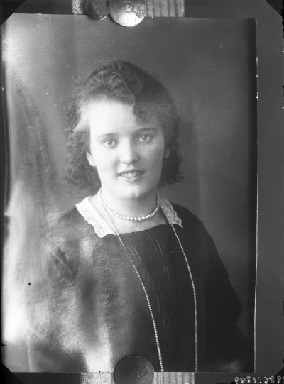 Porträtt av en dam.