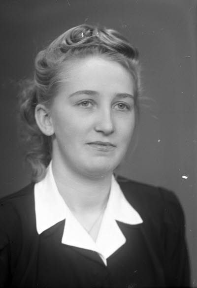 Porträtt av en dam.