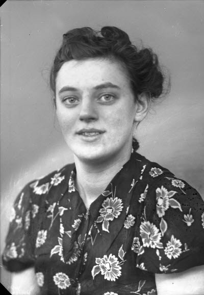 Porträtt av en dam.