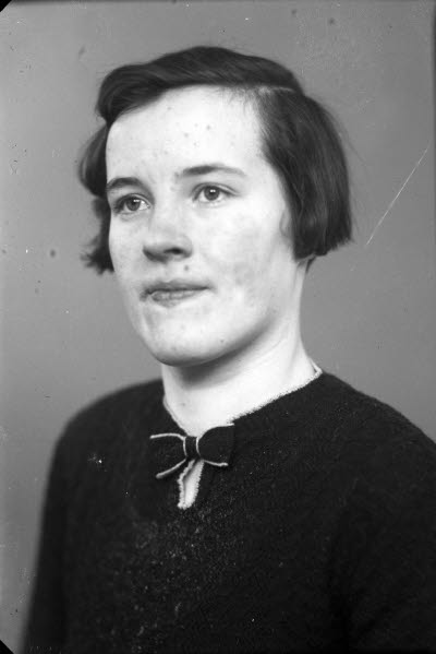 Porträtt av en dam.