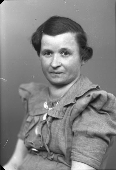 Porträtt av en dam.